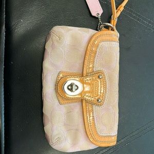 Coach Wristlet light pink and orange straps